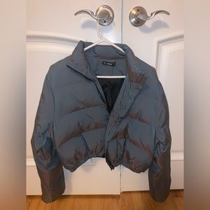 Cropped puffer jacket. Metallic. Colors of blue, purple and gray